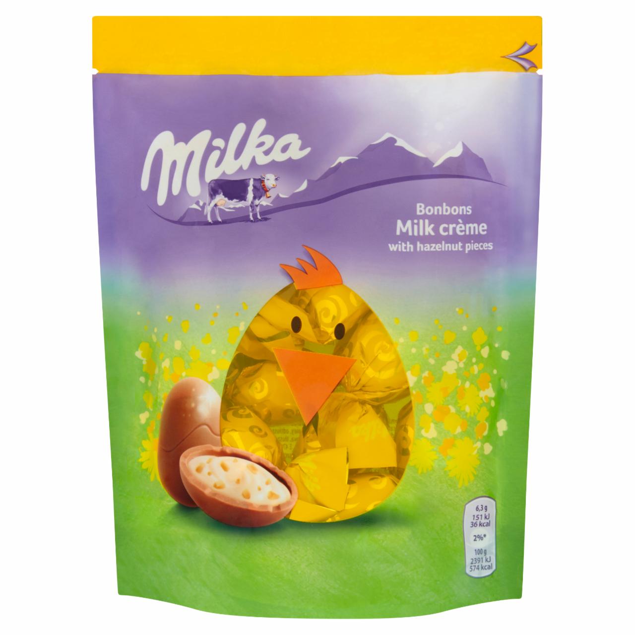 Zdjęcia - Milka Czekolada mleczna z nadzieniem mlecznym i kawałkami orzechów laskowych 86 g