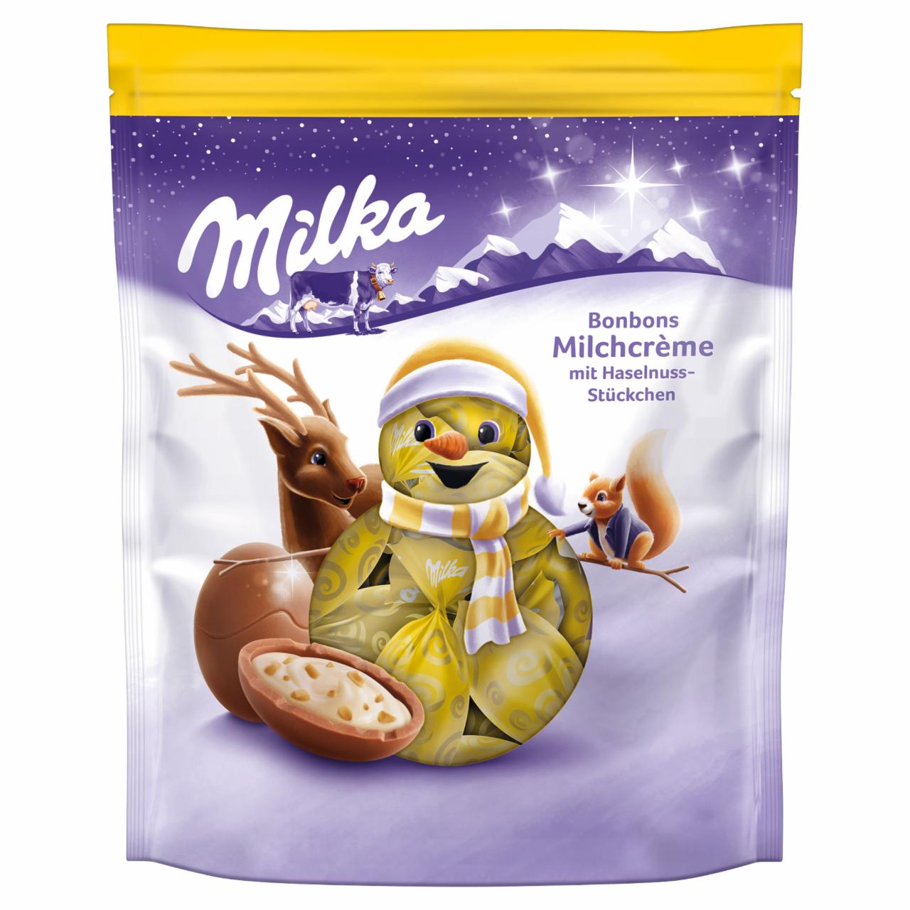 Zdjęcia - Milka Cukierki z nadzieniem mlecznym i kawałkami orzechów laskowych 86 g (14 sztuk)