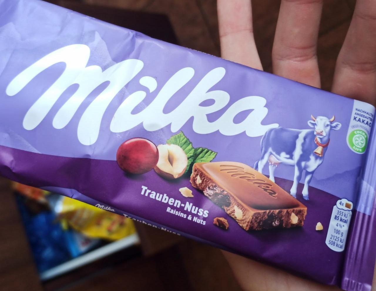 Zdjęcia - Milka Czekolada mleczna z rodzynkami i orzechami laskowymi 100 g