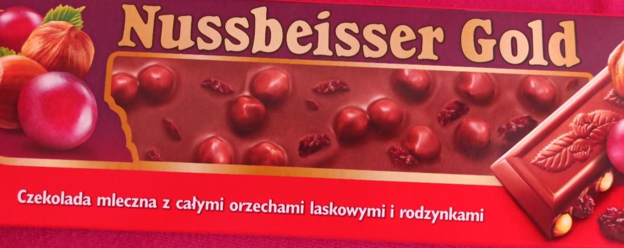 Zdjęcia - Czekolada mleczna z całymi orzechami laskowymi i rodzynkami Nussbeisser Gold